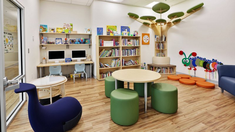 Bright reading and library room with books and creative seating