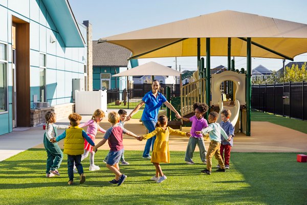 Children playing outside at a Goddard School